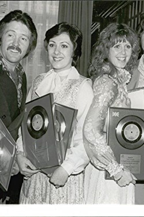 Cover Art for B075YF6KYT, Vintage photo of Martin Lee, Nicky Stevens, Sandra Stevens and Lee Sheridan in the Brotherhood of Man with their gold and silver plates for the song Figaro at Cafe Royal by Unknown