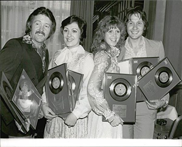 Vintage photo of Martin Lee, Nicky Stevens, Sandra Stevens and Lee Sheridan  in the Brotherhood of Man with their gold and silver plates for the song  Figaro at Cafe Royal: Price Comparison