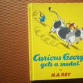 Cover Art for 9780590757713, Curious George Gets a Medal by H. A Rey