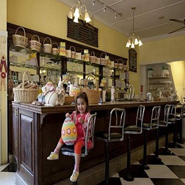 Cover Art for 7435734223204, Young Kate Frommert enjoys all the Easter trimmings at the Three Georges Southern Chocolate Candy Store on Dauphin Street Mobile Alabama Founded in 1917 by George Coudopolos George Sparr and George Pa by 