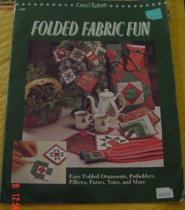 Cover Art for 9780943574691, Folded Fabric Fun: Easy Folded Ornaments, Potholders, Pillows, Purses, Totes, and More by Martin, Nancy J.